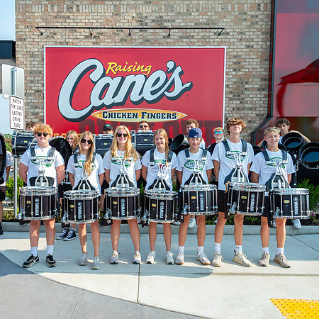 This image of the Greendale Drumline and Poms is from the Grand Opening of Raising Cane's on July 30, 2024. #GreendaleMarchingBand2024 #FreeChicken #WillDrumForFood2024